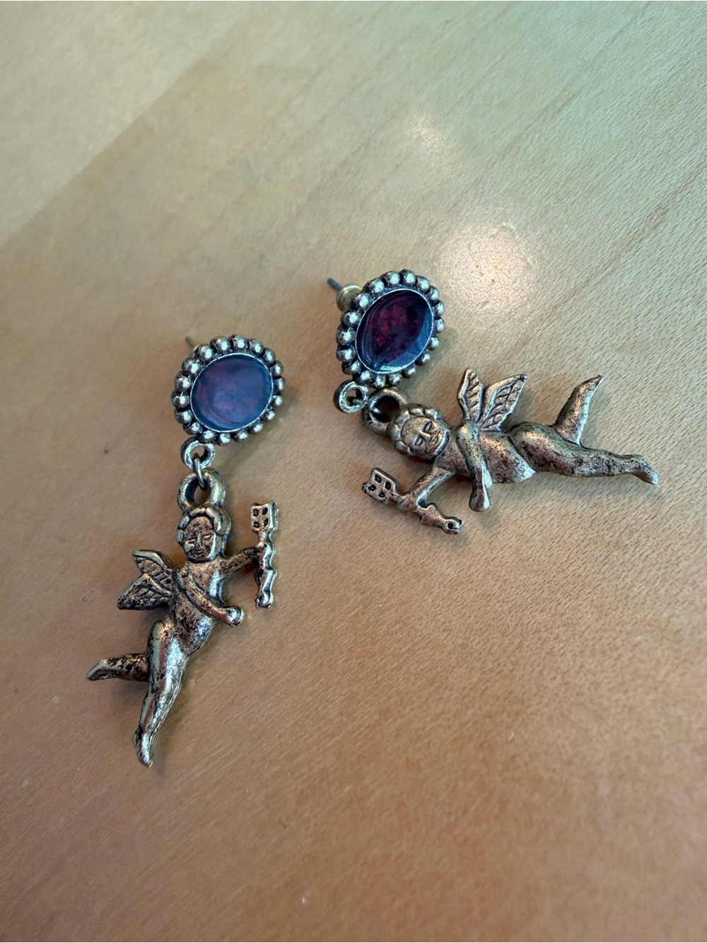 Gold-Tone Cherub Drop Earrings with Dark Red Stone